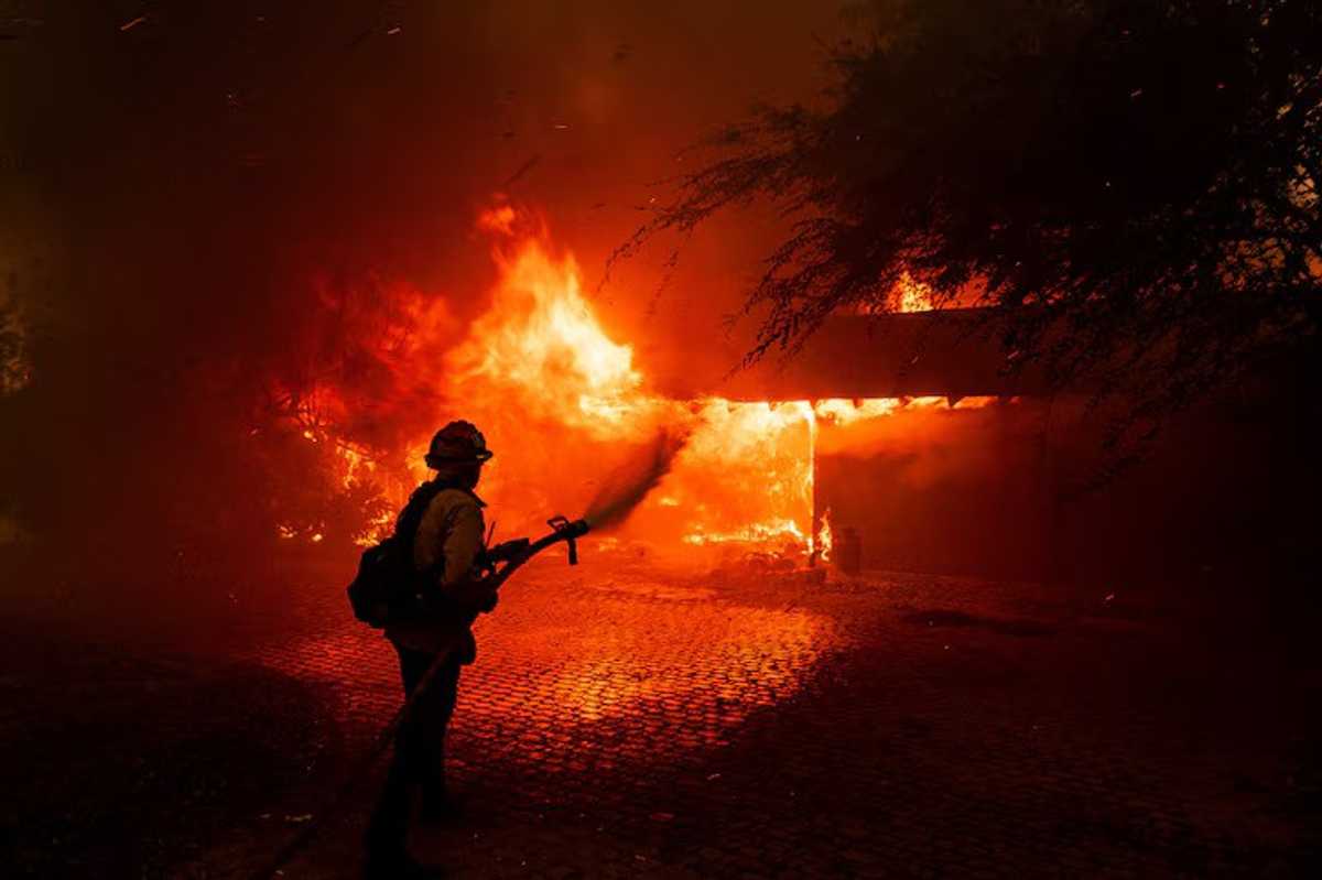 Over 130 homes lost in California wildfire as winds drop