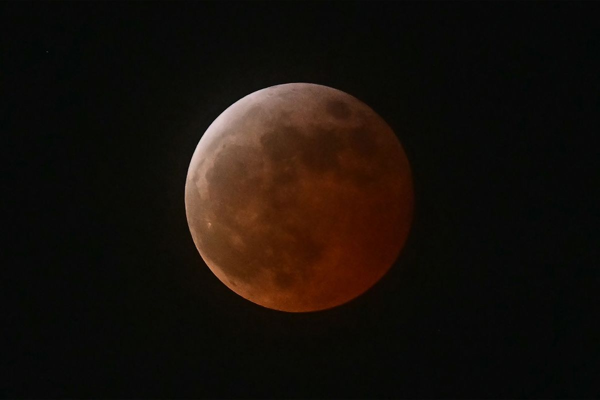 Stargazers marvel at 'Blood Moon', rare total lunar eclipse