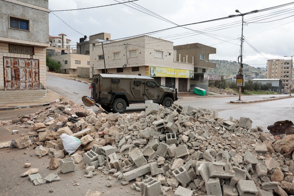 Israel seals off Palestinian village after deadly attack