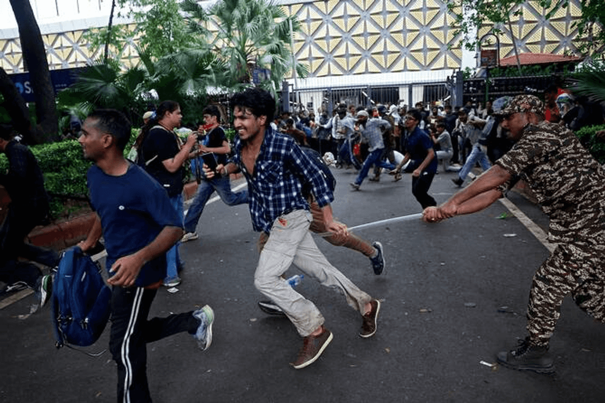 Indian police fire tear gas, baton charge exam protesters