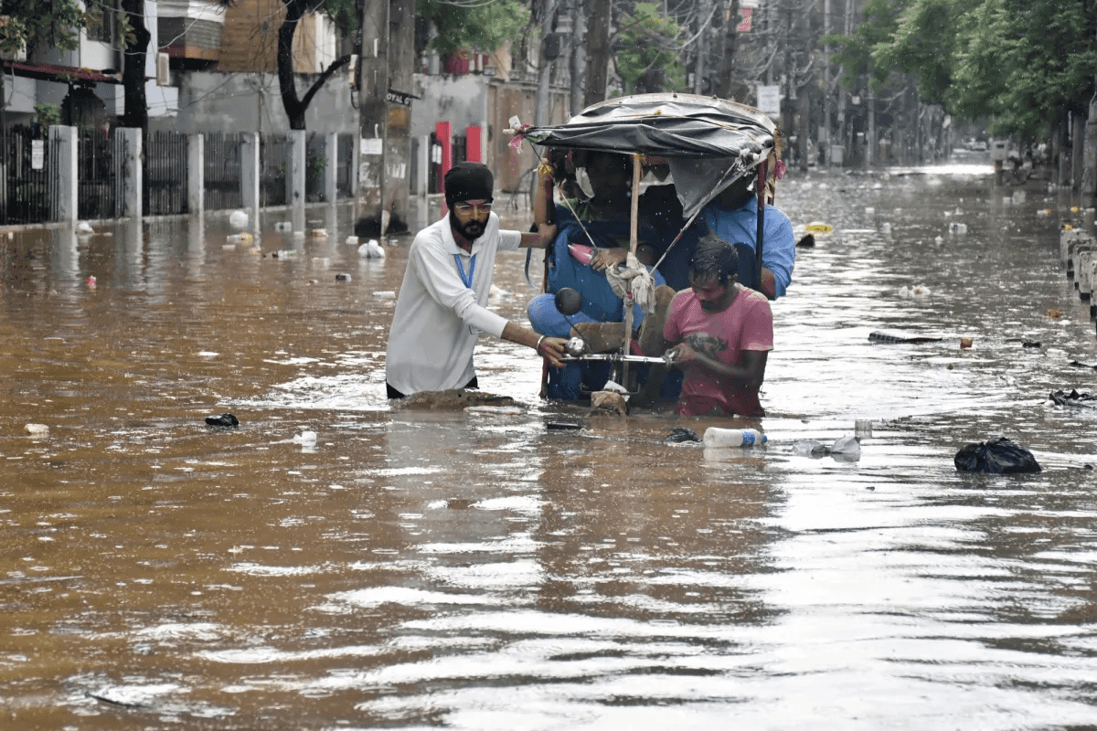 Floods in India's northeast kill nearly 100