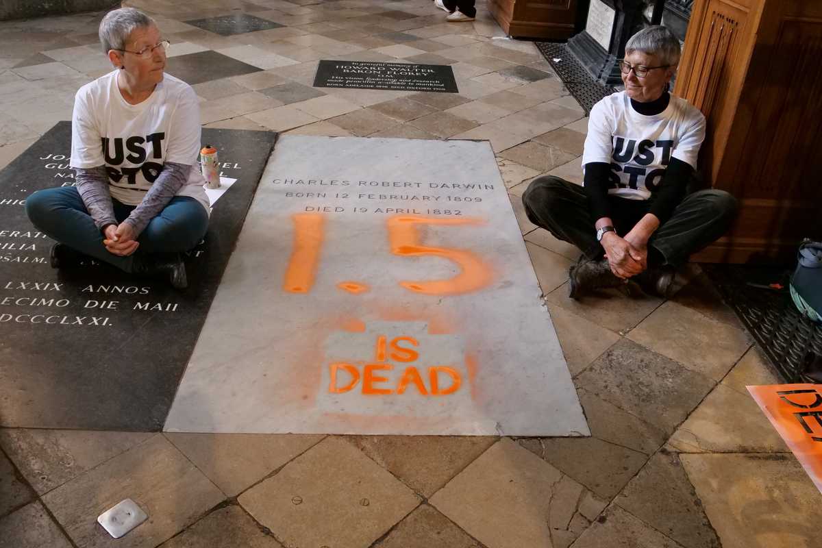 Climate activists paint over Darwin's grave at London's Westminster Abbey
