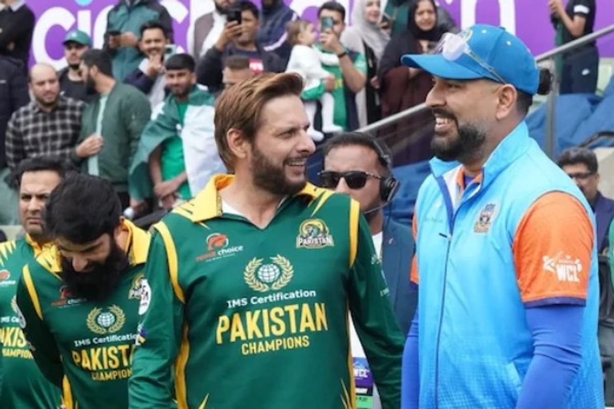 Cricketers in green and blue jerseys smiling, with a crowd in the background.