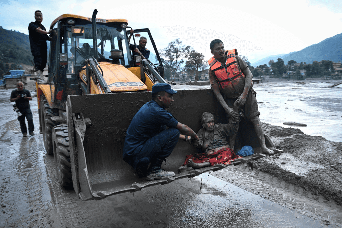 Rescuers claw through mud as missing toll from Nepal, China flood nears 3,000