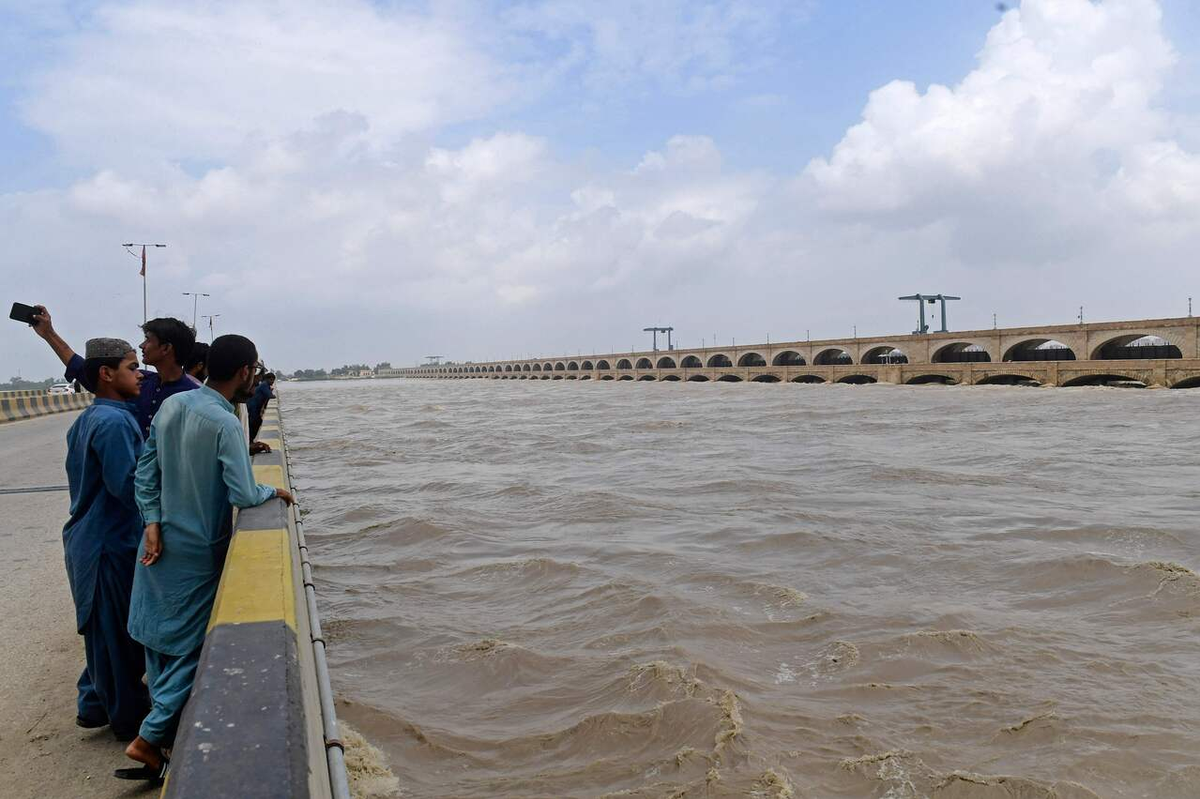 Record river surges in Punjab put southern Pakistan at risk of flooding