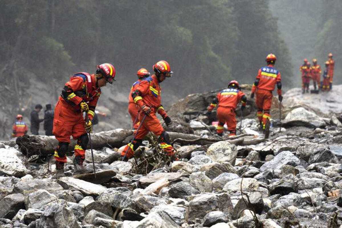 Rescuers dig into tunnel as missing toll from Nepal, China flood tops 3,000