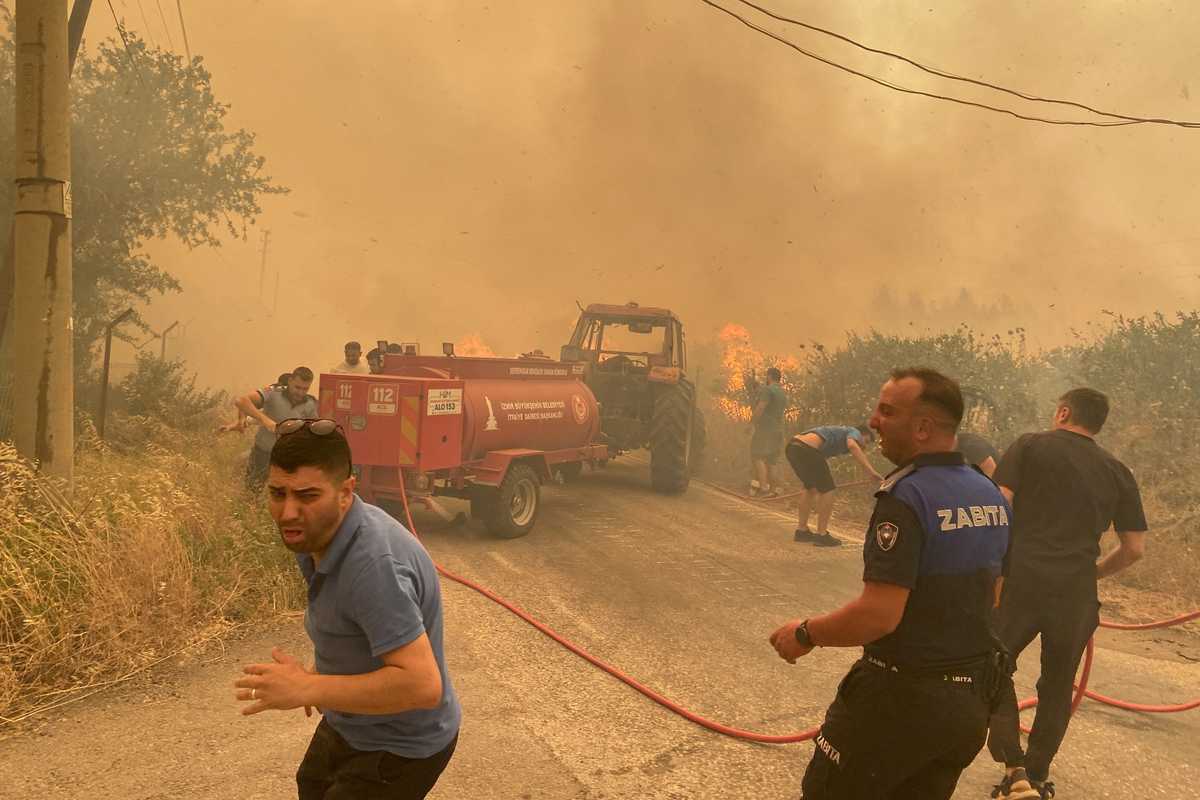 Wildfires burn in Turkey and France as early heatwave hits