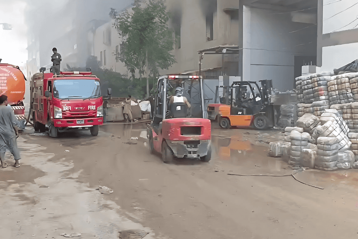 Building collapses as factory fire burns for 14 hours in southern Pakistan