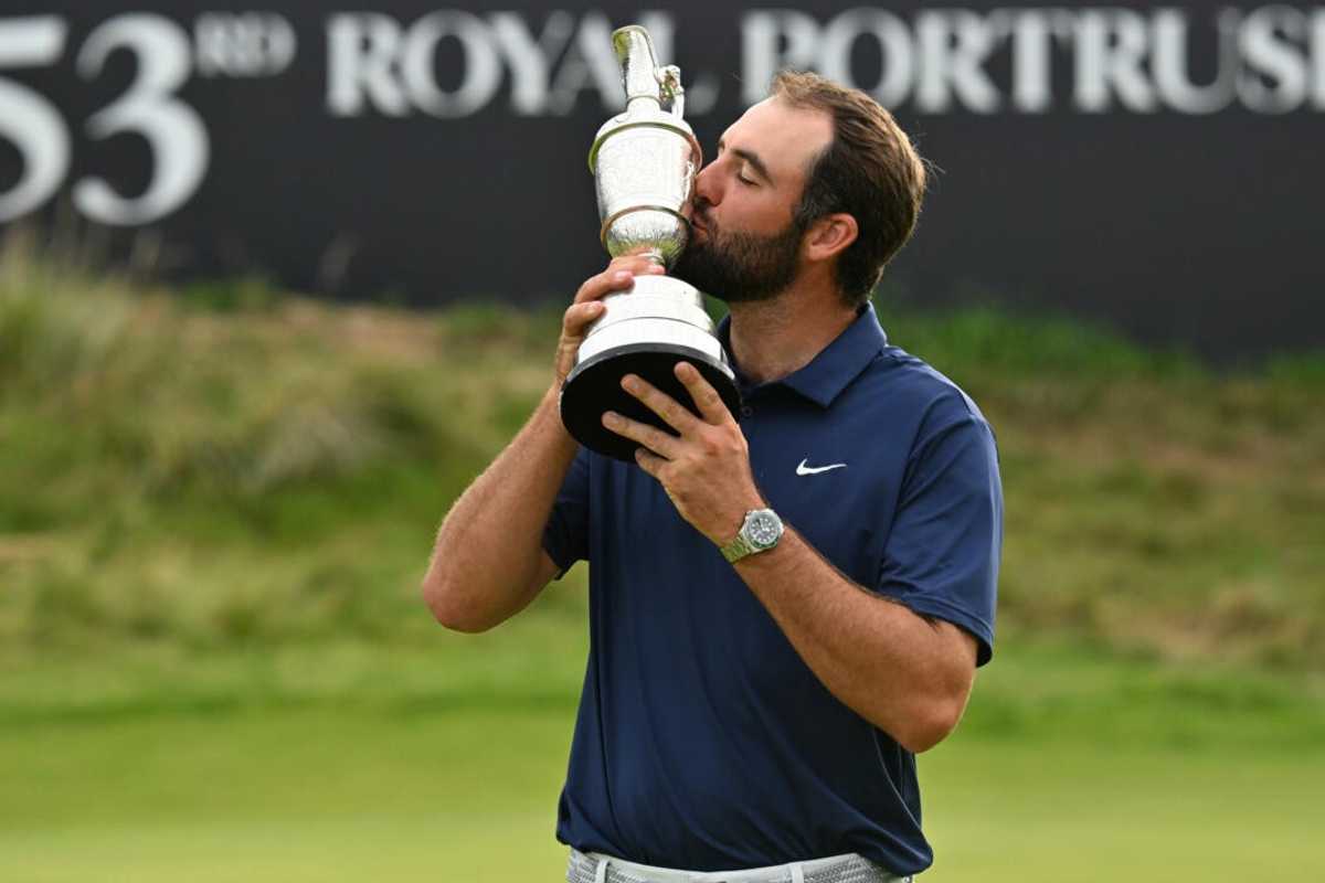 Golfer kissing a trophy at the 153rd Royal Portrush event.