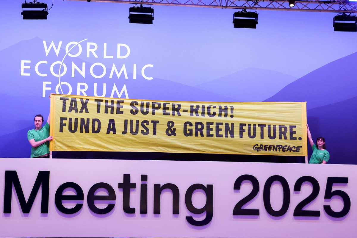 Greenpeace activists stage climate protest inside WEF meeting in Davos