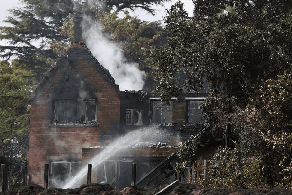 In town hit by wildfire, PM says UK must 'face up to climate change'