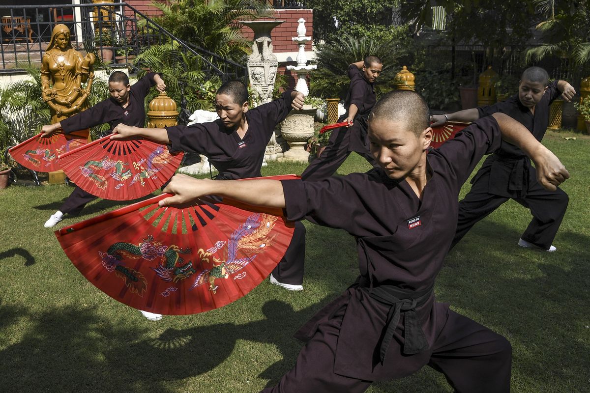 Nepal's 'kung fu nuns' mark monastery reopening with martial arts display