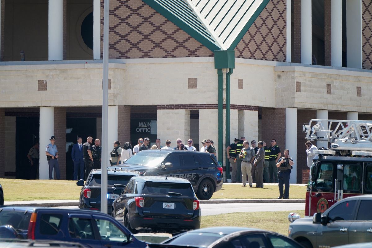 Georgia high school student, 14, kills 4 and wounds 9 in campus shooting