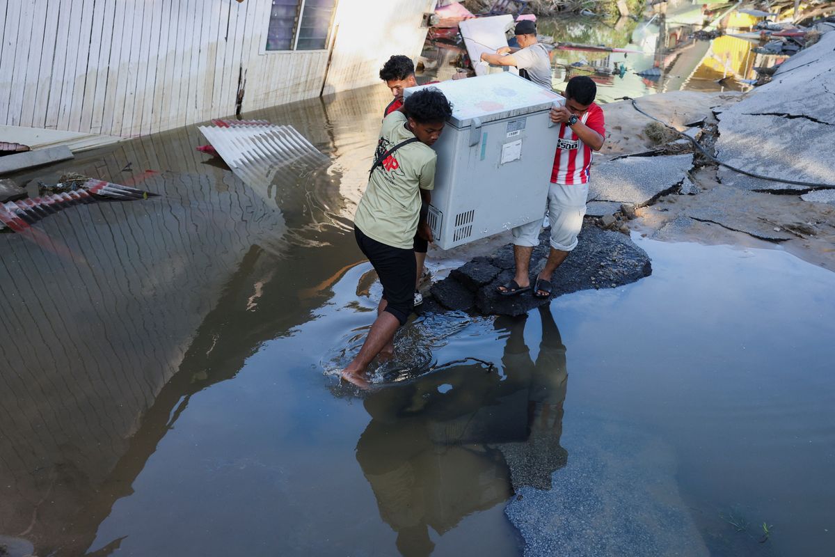 Malaysians return to devastated homes as floodwaters recede; more rain expected