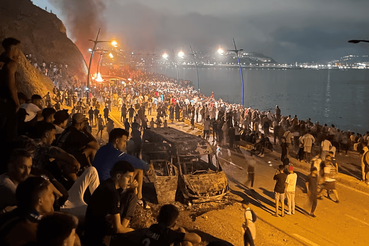 Sleepless night near border of Spain's Ceuta as migrants torch vehicles