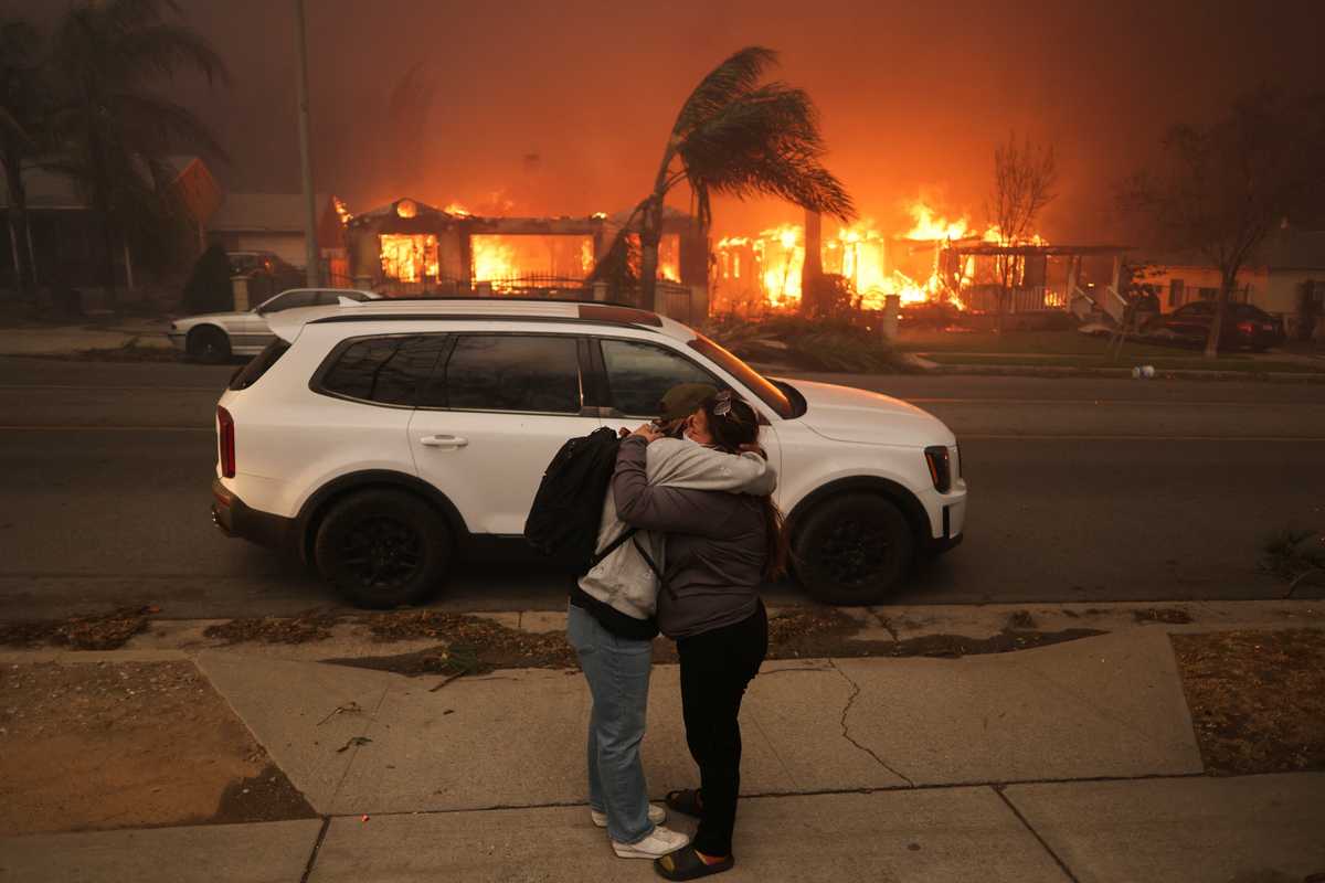 Wildfires rage out of control near Los Angeles, killing at least two