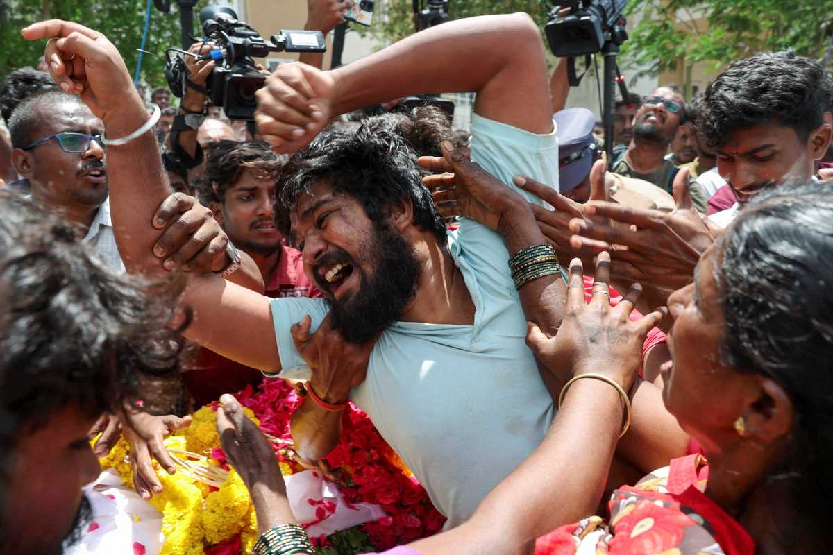 Indian actor-politician's aides charged after rally stampede kills 40