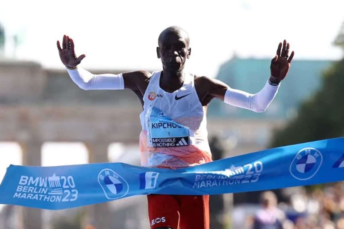 Runner crossing the finish line at the 2023 Berlin Marathon.