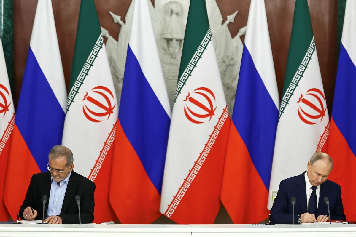 Putin and Iran's president deepen defence ties with 20-year pact