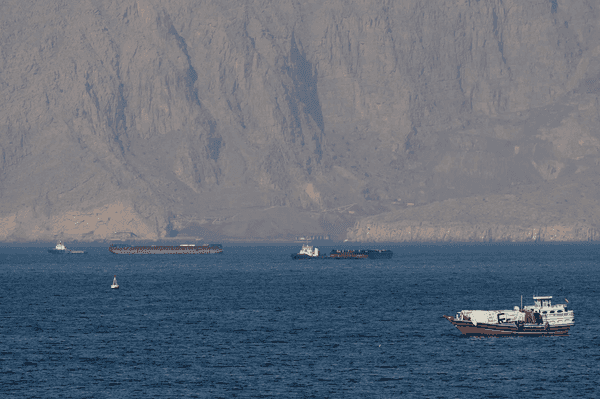 Iran warns of ceasefire violation as US plans to escort Hormuz ships