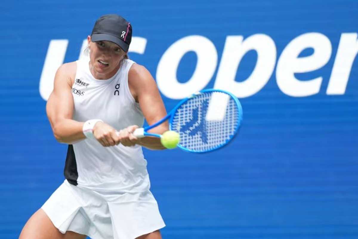 Tennis player hitting a backhand shot at the US Open.