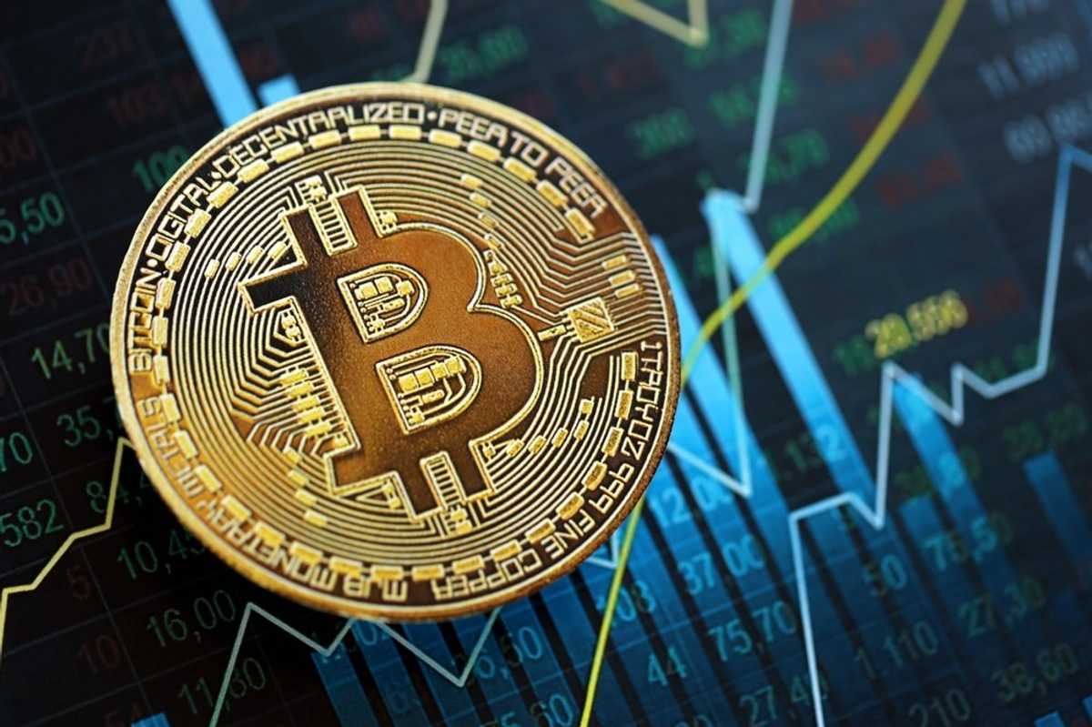 Markets climb, oil slips, Bitcoin nears record