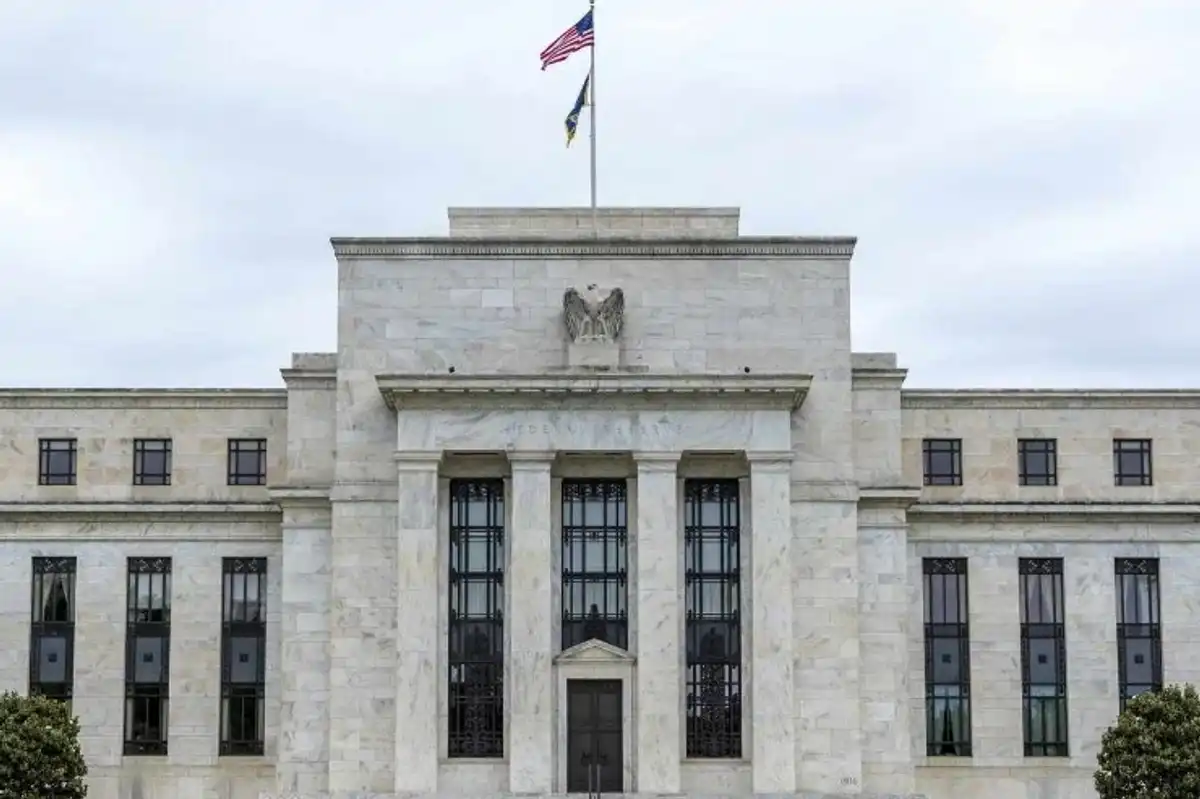 Fed holds rates steady, signals possible cuts by year-end