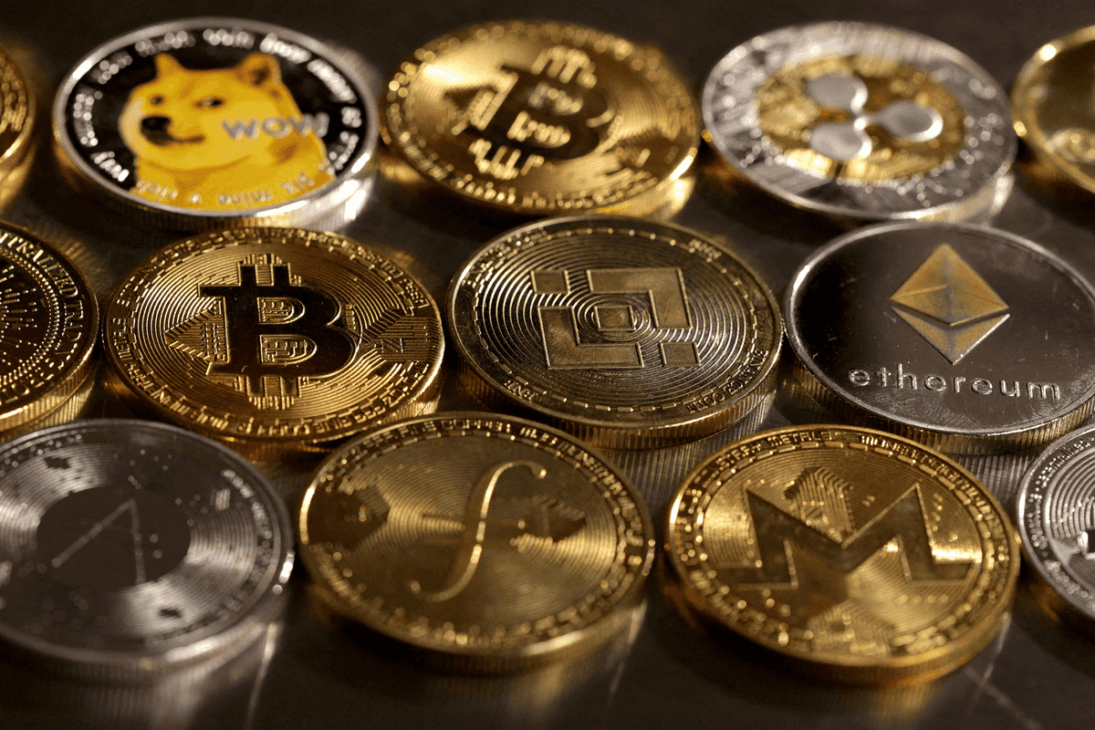 Various cryptocurrency coins, including Bitcoin and Ethereum, displayed closely together.