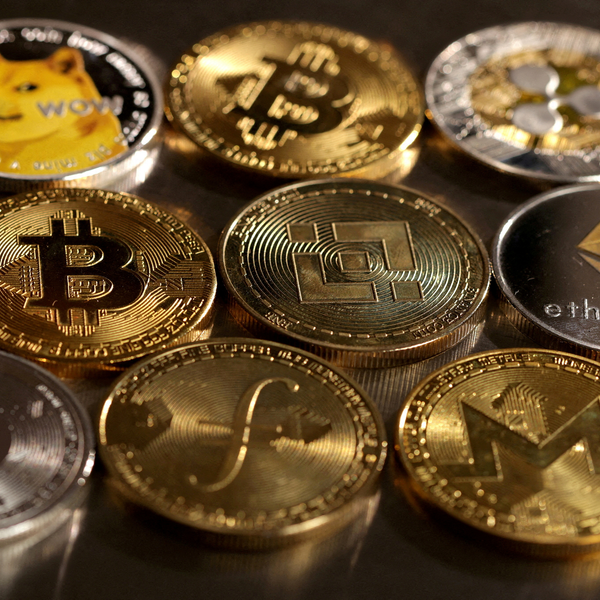 Various cryptocurrency coins, including Bitcoin and Ethereum, displayed closely together.